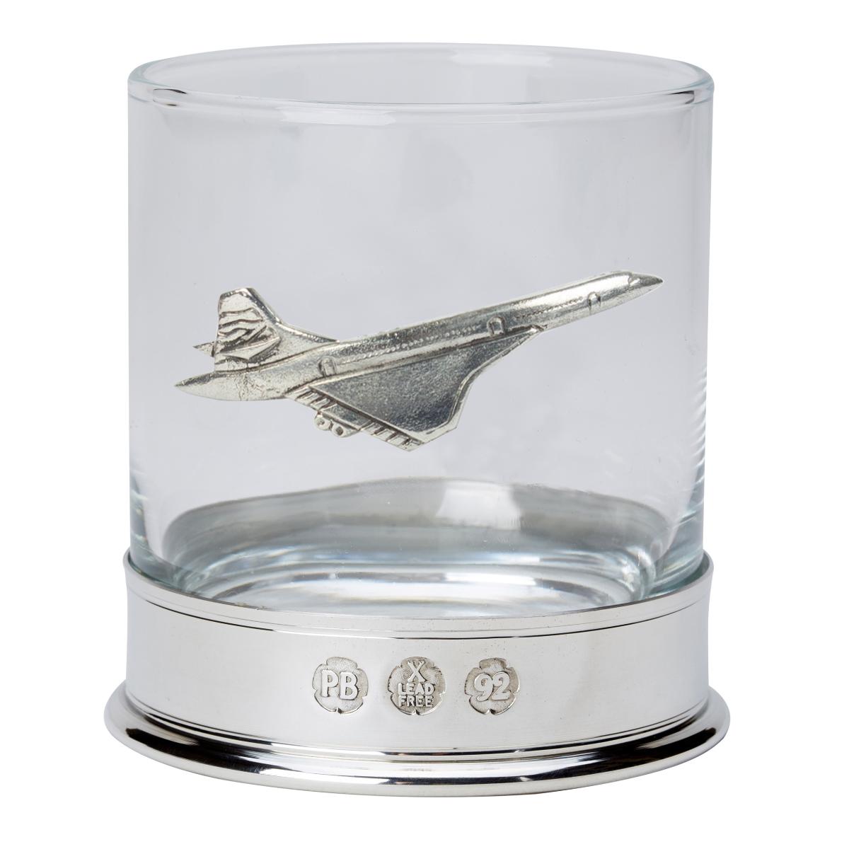 Glass tumbler with a pewter Concorde emblem on a white background