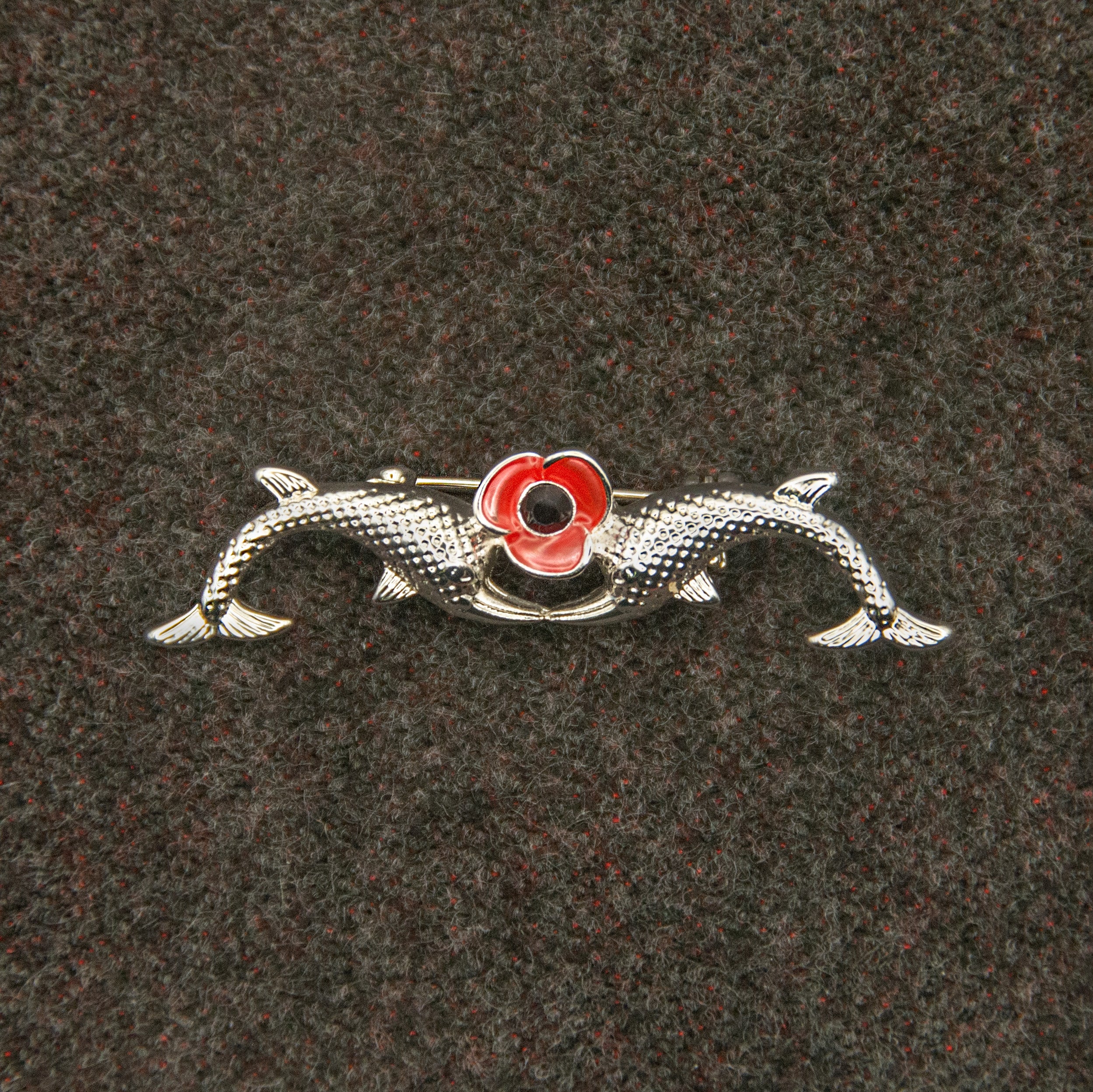 Brooch with red flower and silver dolphins