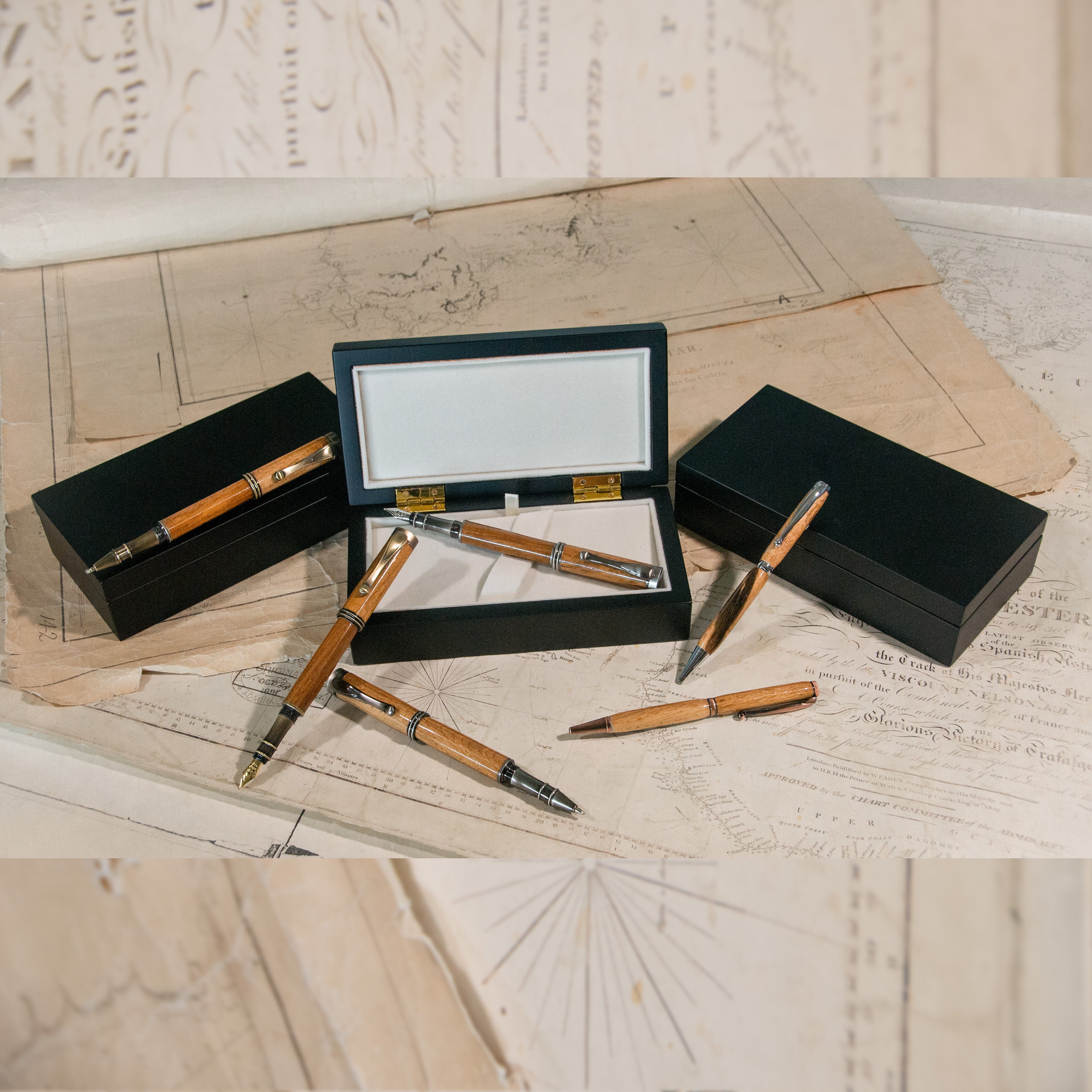 Six wooden pens, with display boxes.