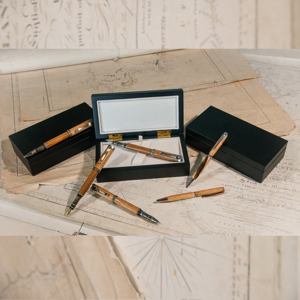 Six wooden pens, with display boxes.