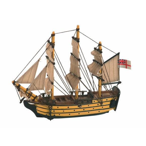 Model of a three-masted sailing ship with a British flag on a white background
