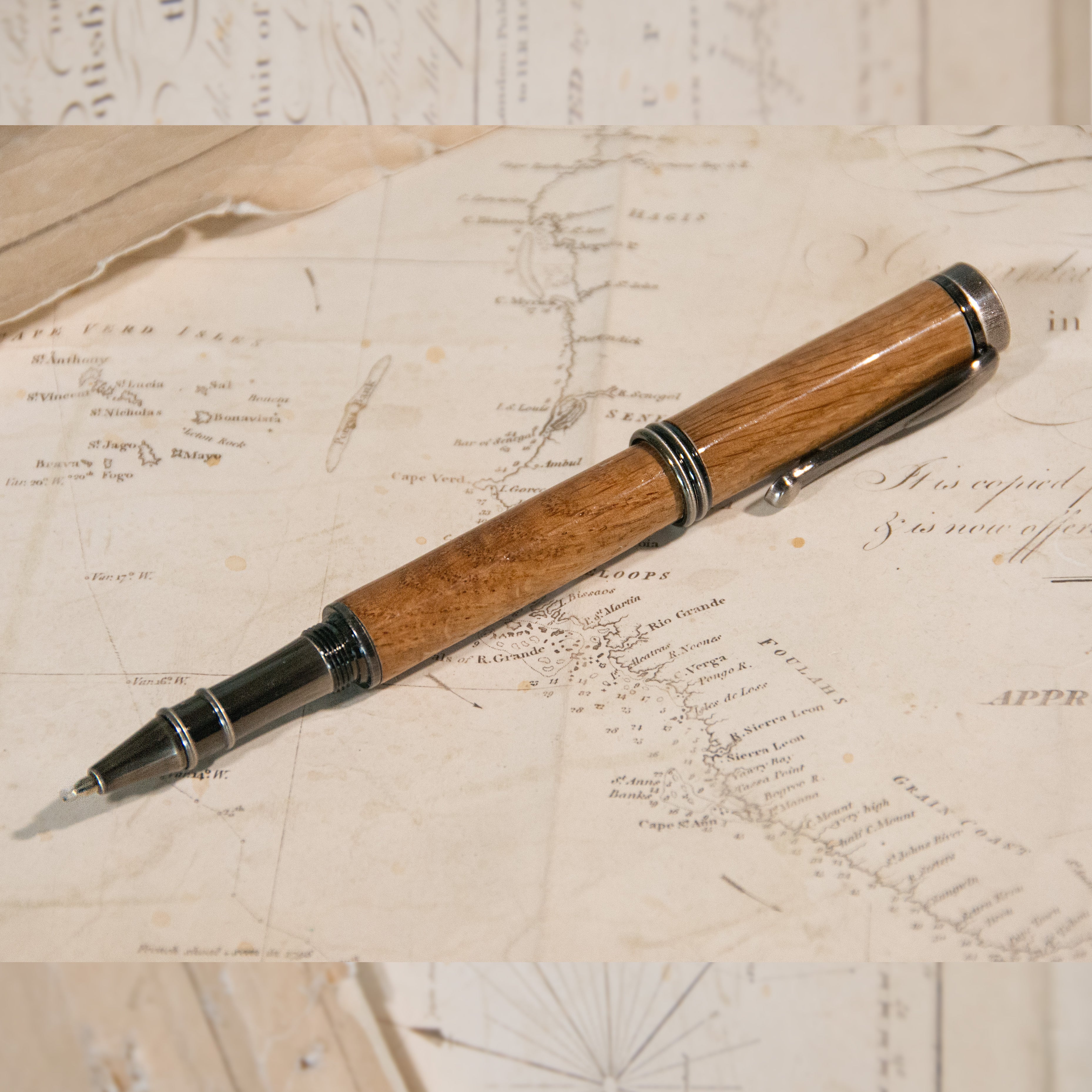A wooden pen with a copper-finished tip.