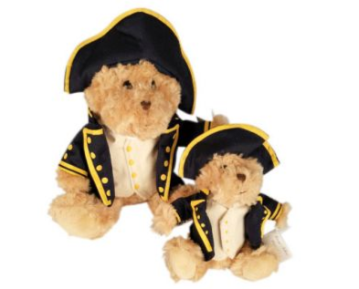 Two teddy bears dressed in formal attire on a white background