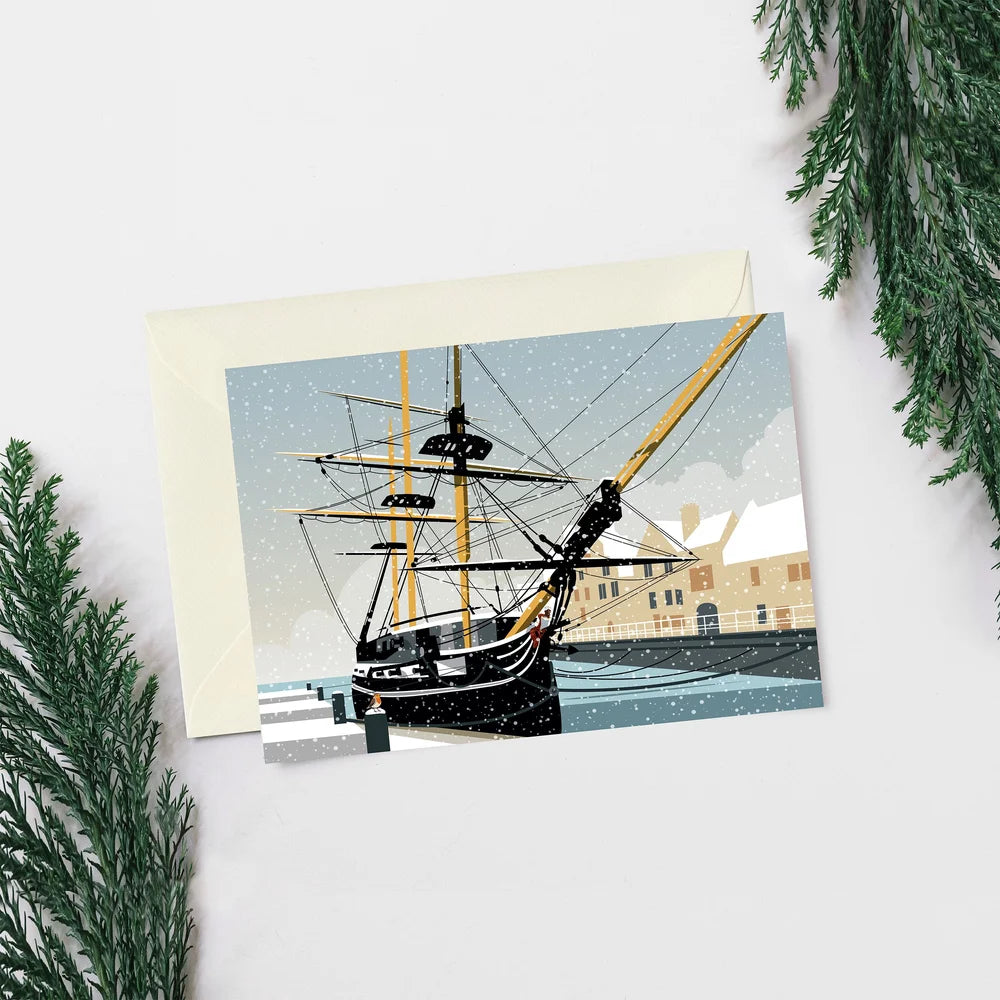 Greeting card with a ship illustration on a white background with greenery.