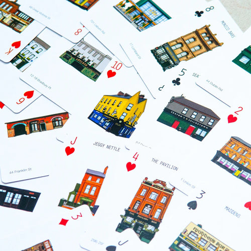 Playing cards with building illustrations on a white background