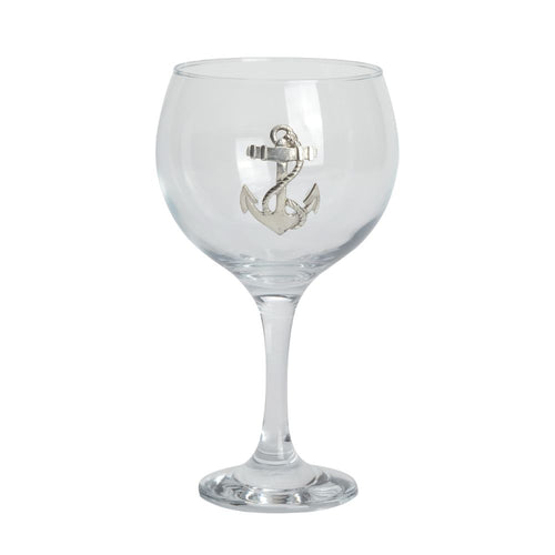 Clear gin glass with an anchor design on a white background