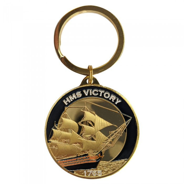 Keychain with HMS Victory ship design on a white background