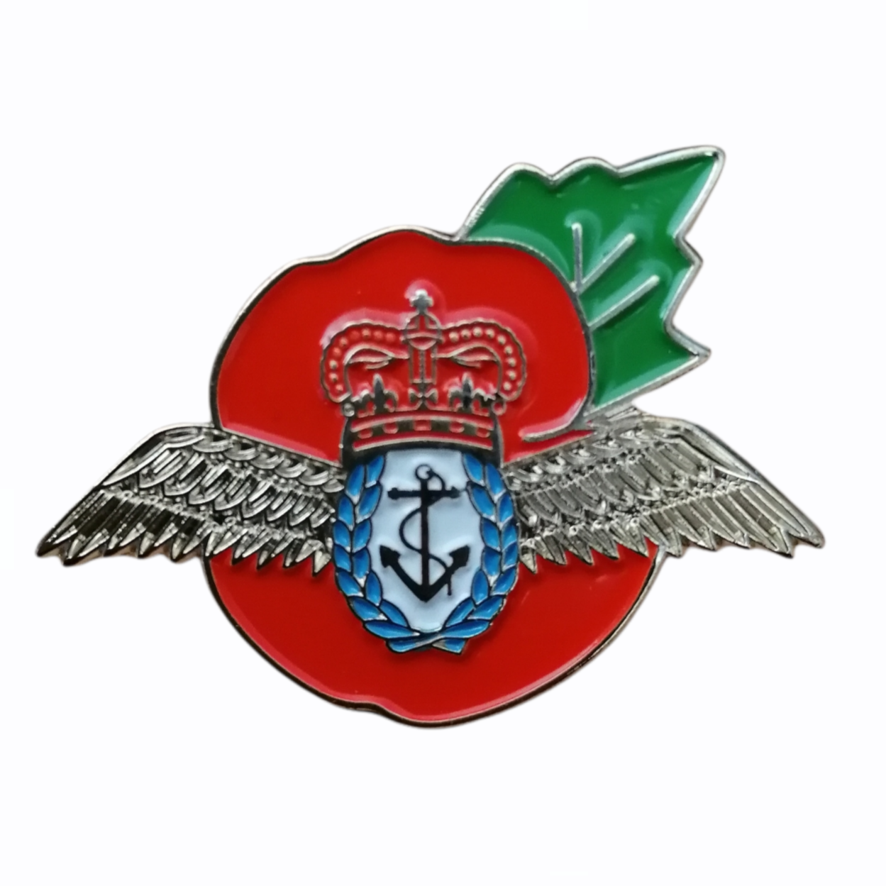 Pin with red background, silver wings, green leaf, and blue emblem with anchor symbol on a white background