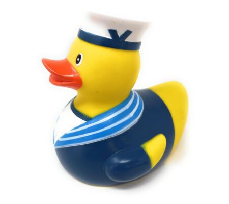Rubber duck dressed as a sailor with a white hat, orange beak, and blue and white striped shirt on a white background.